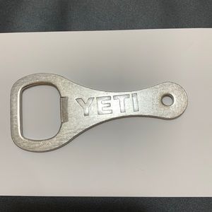 Brand new Yeti bottle opener key.  Be the first to open a cold one with it!